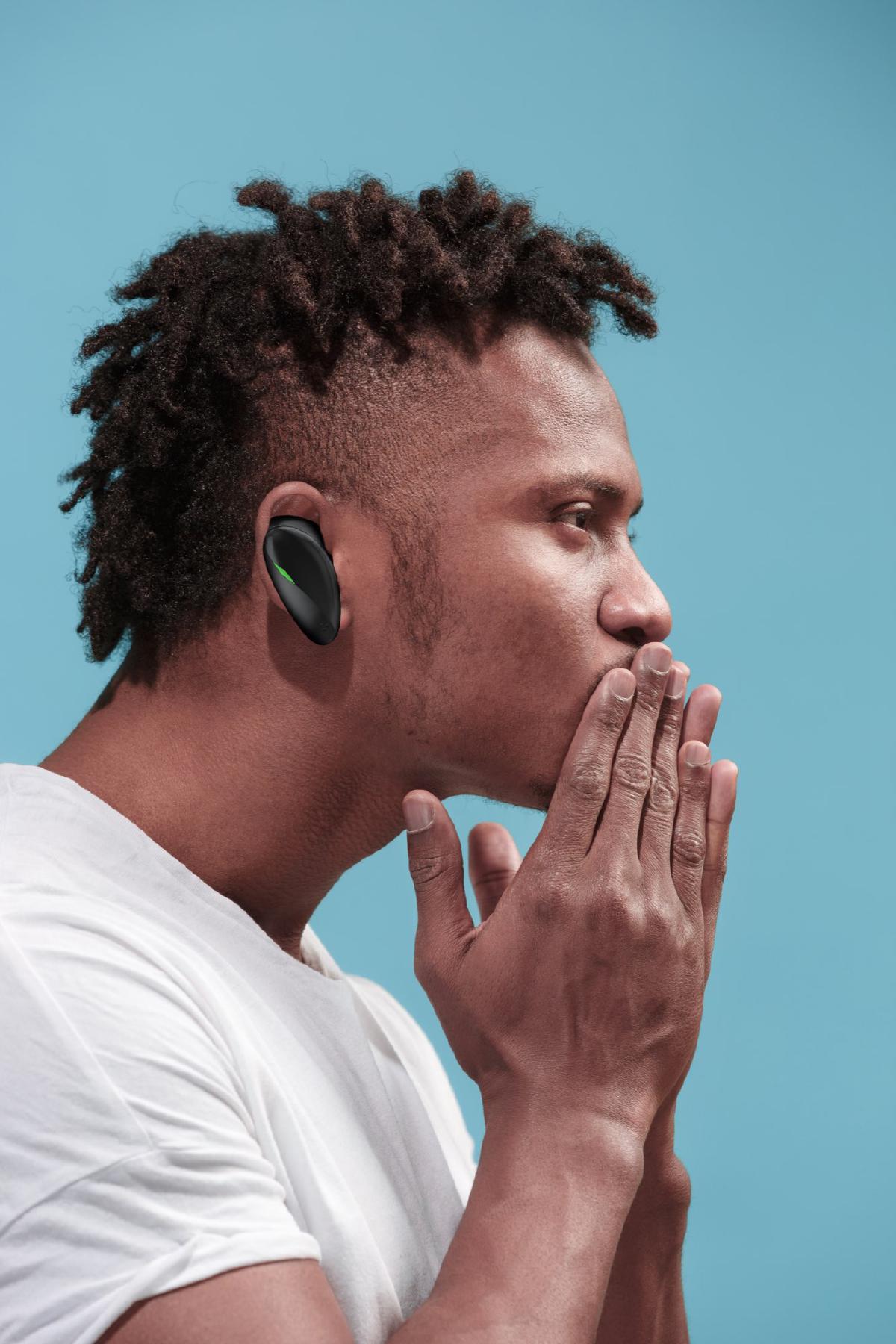 I kiss you. Profile portrait of attractive afro man with air kiss on lips. Blue studio. Beautiful male portrait. Young happy emotional funny man. Human facial emotions concept. Trendy colors